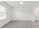 Spacious bedroom with tile flooring, a ceiling fan, and a large window at 8651 Sw 138Th St # 68, Ocala, FL 34473