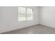 Bright bedroom with neutral tones, tile flooring and a large window with views to the outside at 8651 Sw 138Th St # 68, Ocala, FL 34473