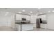 Modern kitchen featuring white cabinetry, stainless steel appliances and tile flooring at 8651 Sw 138Th St # 68, Ocala, FL 34473
