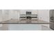 Kitchen island featuring stainless steel appliances and granite countertop at 8651 Sw 138Th St # 68, Ocala, FL 34473
