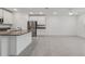 Open kitchen featuring stainless steel appliances, granite countertops, and white cabinetry at 8651 Sw 138Th St # 68, Ocala, FL 34473