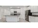 Modern kitchen featuring white cabinets, stainless steel appliances, and granite countertops at 8651 Sw 138Th St # 68, Ocala, FL 34473
