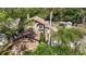 Aerial shot of a two-story home with an attached garage and a well-maintained lawn at 9939 Triple Crown Cir, Orlando, FL 32825