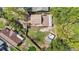 Aerial view of a home with a green backyard and an external storage shed at 9939 Triple Crown Cir, Orlando, FL 32825