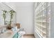 Well-lit bathroom featuring a block window providing natural light and vanity at 9939 Triple Crown Cir, Orlando, FL 32825