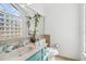 Bright bathroom showcasing a block window providing natural light and turquoise vanity at 9939 Triple Crown Cir, Orlando, FL 32825