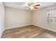 Bedroom with new flooring and modern ceiling fan, offering lots of natural light at 9939 Triple Crown Cir, Orlando, FL 32825