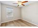 Bedroom offering a modern ceiling fan, new flooring, and lots of natural light at 9939 Triple Crown Cir, Orlando, FL 32825