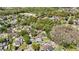 Overhead view of a neighborhood featuring tree-lined streets and houses at 9939 Triple Crown Cir, Orlando, FL 32825