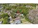 Aerial neighborhood shot with house marked by a red marker at 9939 Triple Crown Cir, Orlando, FL 32825