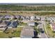 Community aerial shot featuring tree lined streets and neighborhood homes at 10018 Halesia Woods Dr, Orlando, FL 32832