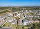 Charming aerial view of a well-maintained community with spacious lots and beautifully landscaped yards at 10018 Halesia Woods Dr, Orlando, FL 32832