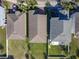 Aerial view showcases the backyard and neighboring homes at 10018 Halesia Woods Dr, Orlando, FL 32832