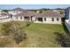 Expansive backyard featuring a well-manicured lawn and plenty of space for recreation and relaxation at 10018 Halesia Woods Dr, Orlando, FL 32832