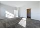 Well-lit bedroom with carpet flooring, closet, and natural light at 10018 Halesia Woods Dr, Orlando, FL 32832