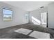 Bright bedroom featuring carpet flooring and large windows for natural light at 10018 Halesia Woods Dr, Orlando, FL 32832