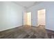 Comfortable bedroom with carpet flooring and access to the closet at 10018 Halesia Woods Dr, Orlando, FL 32832
