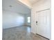 Welcoming foyer with tile flooring leading into a spacious living area at 10018 Halesia Woods Dr, Orlando, FL 32832