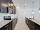 Gourmet kitchen features a large island, stainless appliances, and modern lighting at 10018 Halesia Woods Dr, Orlando, FL 32832