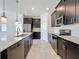 Kitchen features a large center island and stainless steel appliances at 10018 Halesia Woods Dr, Orlando, FL 32832