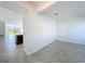 Bright and airy living space with tile floors and an open view into the adjacent dining area at 10018 Halesia Woods Dr, Orlando, FL 32832