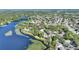 Stunning aerial view of lakefront property with beautiful lake and lush landscaping at 1178 Vineland Pl, Lake Mary, FL 32746