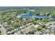 Community aerial view of neighborhood near a lake, showcasing lush greenery and homes at 1178 Vineland Pl, Lake Mary, FL 32746