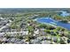 Serene aerial view of a neighborhood with a beautiful lake, highlighting natural surroundings at 1178 Vineland Pl, Lake Mary, FL 32746