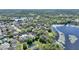 Panoramic aerial view of lakefront homes, lush green trees, and serene water views at 1178 Vineland Pl, Lake Mary, FL 32746