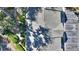 Overhead view of building with gray shingled roof and adjacent parking lot, surrounded by lush green landscaping at 1178 Vineland Pl, Lake Mary, FL 32746