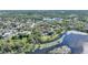 Scenic aerial shot of the lakefront property showcasing a tranquil setting with lush landscape at 1178 Vineland Pl, Lake Mary, FL 32746