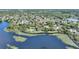 Picturesque aerial view of the lakefront community with stunning water views and greenery at 1178 Vineland Pl, Lake Mary, FL 32746