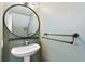 Powder room with pedestal sink and decorative mirror at 1178 Vineland Pl, Lake Mary, FL 32746