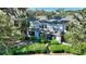 Exterior view of townhome featuring multiple units, with lush landscaping and a private patio at 1178 Vineland Pl, Lake Mary, FL 32746