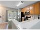 Well-lit kitchen features stainless steel appliances and light wood cabinets at 1178 Vineland Pl, Lake Mary, FL 32746