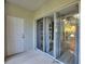 View of a patio with sliding glass doors leading to the home's interior at 1178 Vineland Pl, Lake Mary, FL 32746