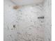 Close up of the bathroom shower, showcasing the marble style tiling and gold shower head at 1208 Bonaire Dr, Leesburg, FL 34748