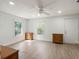 Bright bedroom with natural light and wood-look floors at 1208 Bonaire Dr, Leesburg, FL 34748