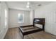 Bedroom with fresh paint, new floors, and good natural light from one window at 1208 Bonaire Dr, Leesburg, FL 34748