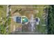 Aerial view displays this properties massive acreage, luxury pool, multiple buildings, and privacy at 12323 Sweet Hill Rd, Polk City, FL 33868