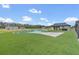 Beautiful backyard with unique inground pool, turf grass, and great views of trees in a private area at 12323 Sweet Hill Rd, Polk City, FL 33868