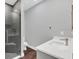 Modern bathroom featuring a glass shower with chrome hardware and a bright white sink and vanity at 12323 Sweet Hill Rd, Polk City, FL 33868
