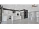 Sleek kitchen with white cabinetry, stainless steel appliances, and a center island with pendant lighting at 12323 Sweet Hill Rd, Polk City, FL 33868