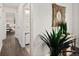 Hallway view with interior doors, decorative mirror, and stylish decor at 124 Oakridge Ave, Edgewater, FL 32132