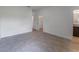Bedroom with tile flooring, with access to a walk-in closet and view of the en-suite bathroom at 13687 Sw 33Rd Cir, Ocala, FL 34473