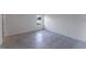 A bright bedroom featuring gray tile flooring and a window bringing in natural light at 13687 Sw 33Rd Cir, Ocala, FL 34473