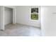 Well-lit bedroom with closet and a large window offering natural light at 13687 Sw 33Rd Cir, Ocala, FL 34473