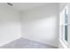 Bedroom with gray tile flooring and a large window offering plenty of natural light at 13687 Sw 33Rd Cir, Ocala, FL 34473