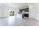 Open-concept kitchen with stainless steel appliances, dark cabinetry and an island with granite countertops at 13687 Sw 33Rd Cir, Ocala, FL 34473