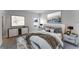 Cozy bedroom featuring modern furnishings, neutral decor, and ample natural light from the window at 13687 Sw 33Rd Cir, Ocala, FL 34473